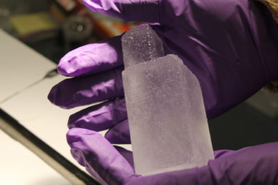 Scientist Ed Brook holds an ice core dating back 2 million years.