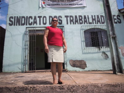 Maria Joel Dias da Costa in front of the farmworker union's building in Rondon do Pará.
