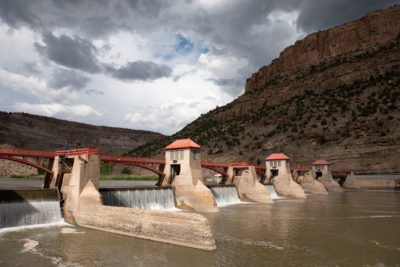 The Grand Valley Diversion Dam, completed in 1916, channels water from the Colorado River to western Colorado’s peach orchards and vast agricultural fields.