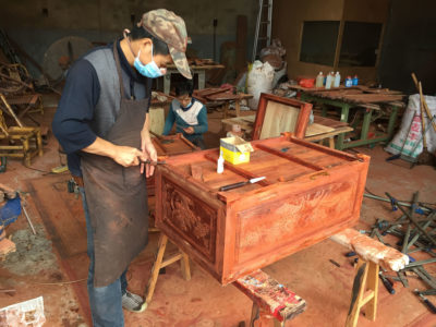 Workers assemble rosewood furniture at a Xianyou factory.