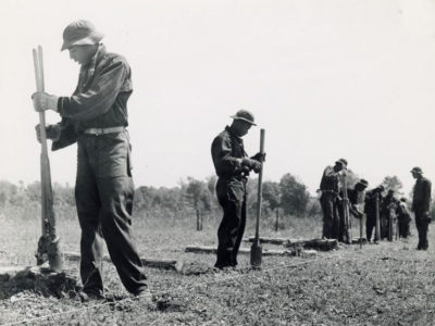 Young Black volunteers for the Civilian Conservation Corps build a fence in Georgia in 1941. Because of racist pressure, Corps crews were segregated. 
