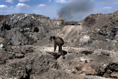A worker climbs through a copper and cobalt mine in Kawama, Democratic Republic of Congo.