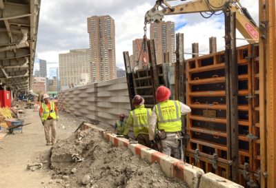 Workers complete a floodwall at Stuyvesant Cove Park in 2021 as part of the East Side Coastal Resiliency project.