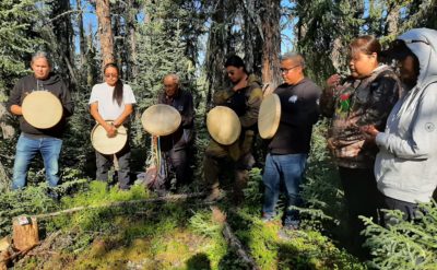 Indigenous Łı́ı́dlı̨ı̨ Kų́ę́ people at a ceremony marking their taking charge of the Scotty Creek Research Station.