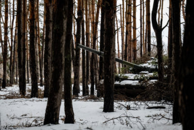 A Ukrainian tank hidden in a forest in the Donetsk Region in February 2023.

