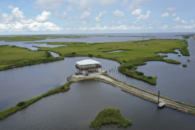 A home in Grand Isle, Louisiana, where land is disappearing underwater.