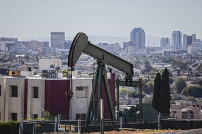 An oil well in Signal Hill with the City of Long Beach in the background.