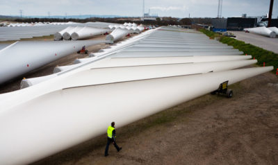 Wind turbine blades ready to be shipped from a storage facility in Aalborg, Denmark.