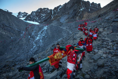 Pilgrims in Peru's annual Quyllurit’i festival descend from the Colquepunco glacier in May 2018.