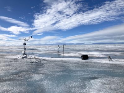 A weather station on the melting Greenland ice sheet.