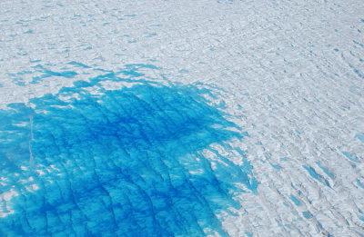 A meltwater pond atop the Greenland ice sheet.