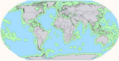 A global map showing the high seas (blue) and national exclusive economic zones (green), which stretch 200 miles off coastlines.
