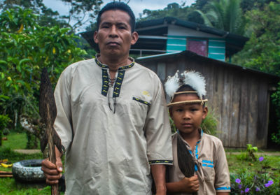 A member of the Naso tribe and his son.