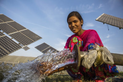 A farm worker uses a solar-powered water pump in the village of Jagadhri in northern India.