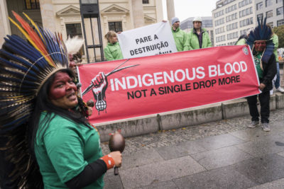 Indigenous leaders from Brazil protest outside a corporate sustainability meeting in Germany in October, calling for the end of deforestation. 