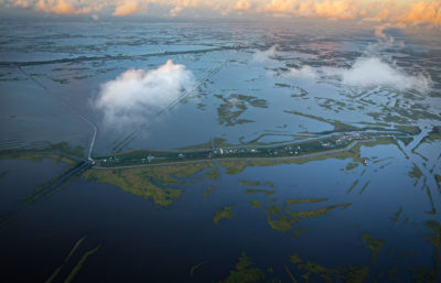 Isle de Jean Charles - or what’s left of it - is a small enclave of houses on a narrow, one-and-and-a-half mile long strip of land. As south Louisiana wetlands continue to sink and as sea levels continue to rise, the island has become a vulnerable environmental outpost ringed by a low levee. 