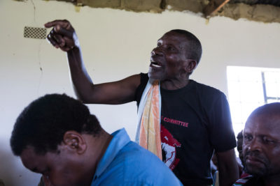 Villager Mathentombi Dimane questions anti-mining leaders at the community meeting in Xolobeni.