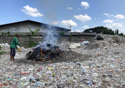 A plastic dump, full of foreign waste, near a paper mill in East Java. 