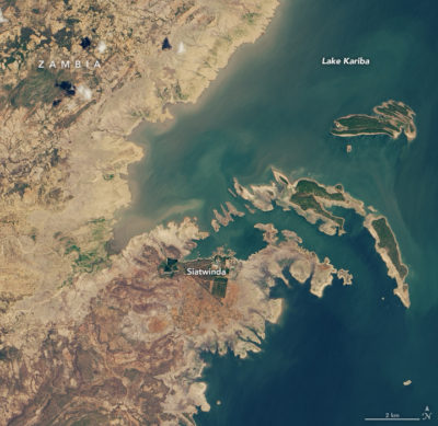 Lake Kariba, the world’s largest reservoir, in 2018 (left) and 2019 (right), after drought lowered water levels, stunting hydropower output at the Kariba Dam on the Zambia-Zimbabwe border.
