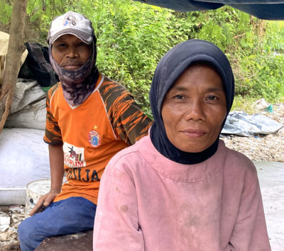 Kasih, who collects plastic from the waste pile next to Indah Kiat Pulp &amp; Paper, and her husband.