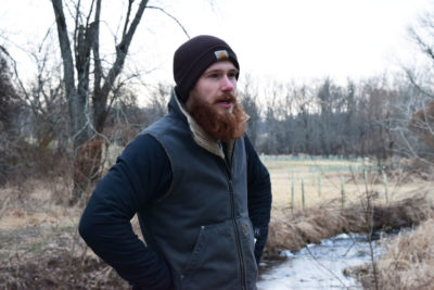 Agroforester Austin Unruh in the buffer he created alongside Beaver Run.