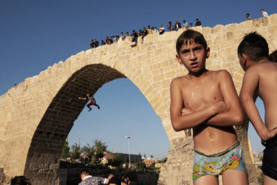 Children play under the Deral Bridge over the Zebir River, a tributary of the Tigris, in Zakho, Iraq.