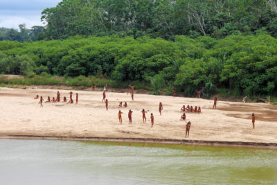 Indigenous Mashco Piro people, seen near logging operations in the Peruvian Amazon.