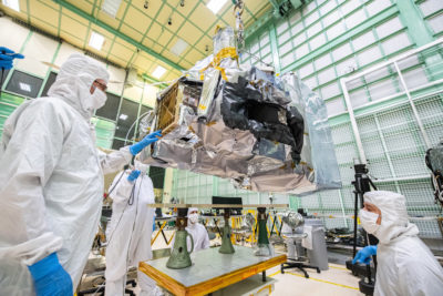 Technicians ready an instrument for NASA's new PACE satellite that measures ocean color.