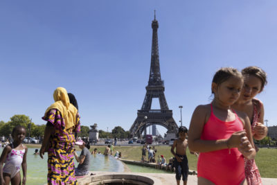 Parisians cool off at the Trocadero Fountain during a heat wave, August 3, 2022.