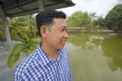 Thiu Hoang Pho, who works at a freshwater pond in Phu Tan, collects rainwater to raise fish.