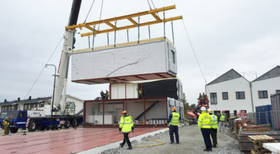 A prefabricated section of the Power of 10 development in Sweden being lifted into place.
