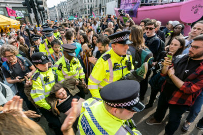 A protester gets arrested in London's Oxford Circus on April 19.