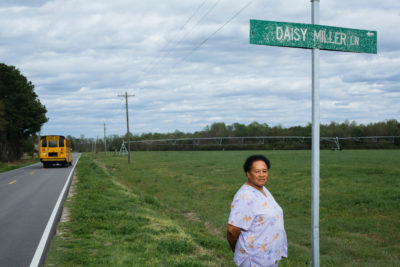 Renee Miller, across from her home by a road named for her mother, was one of the plaintiffs in a lawsuit against a Smithfield subsidiary for spraying hog waste on this field. 
