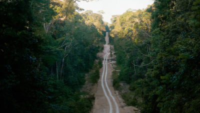 A road cut into the Amazon rainforest near Manaus, Brazil.