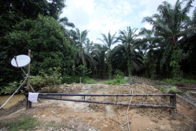 Villagers from Sugai Bekelit blocked this road to deny a Malaysian palm oil  company access to their lands. 