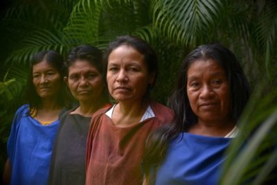 Adelina Vargas, Lita Rojas, Julia Pérez, and Ergilia Rengifo, the wives of four Indigenous Saweto men who were murdered in 2014 for fighting back against illegal logging in the Peruvian Amazon. 