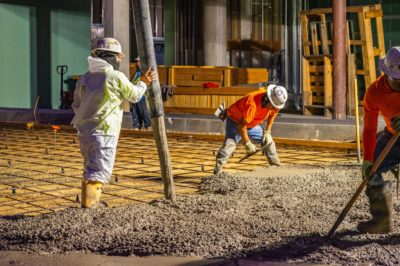 Workers in Sugar Land, Texas, pour concrete bound by Terra CO2 cement, which is made with mining waste.