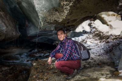 Glaciologist Giuseppe Cola, 60, next to a meltwater stream inside the Forni Glacier. "When you enter the core of a glacier along the conduits and caves dug by meltwater," he says, "you are completely captivated by the spectacle that surrounds you." 