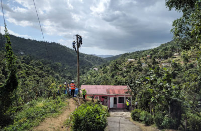 The U.S. Army Corps of Engineers erects electricity lines in San German, Puerto Rico in February 2018. Some of the island's mountain communities still do not have power, eight months after the storm.