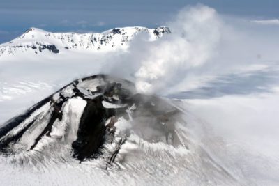 Mount Veniaminof, an active volcano in southern Alaska, is capped by a glacier.