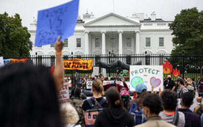 Climate protesters demonstrate outside the White House, October 12, 2021.


