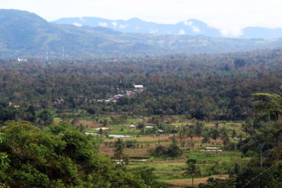Bongkaras village, seen from the hills above and at the road entering town, is 2.5 kilometers from the proposed tailings dam site.
