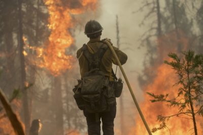 A firefighter battles the 2018 Ferguson Fire in California.