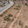 The remnants of canals used by the Hohokam people for centuries can still be seen in the sandy soil here in Mesa, Arizona, with the ancient canal path running parallel to the modern-day South Canal, which carries water from the Salt River. 